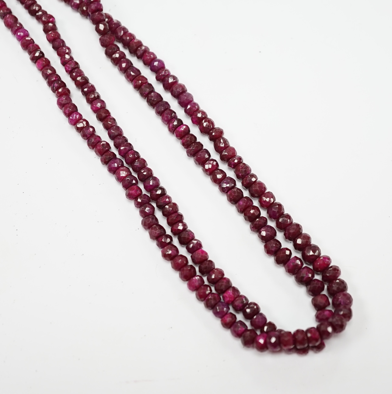 An Indian double strand facetted ruby bead necklace, ruby section only 38cm. Condition - fair